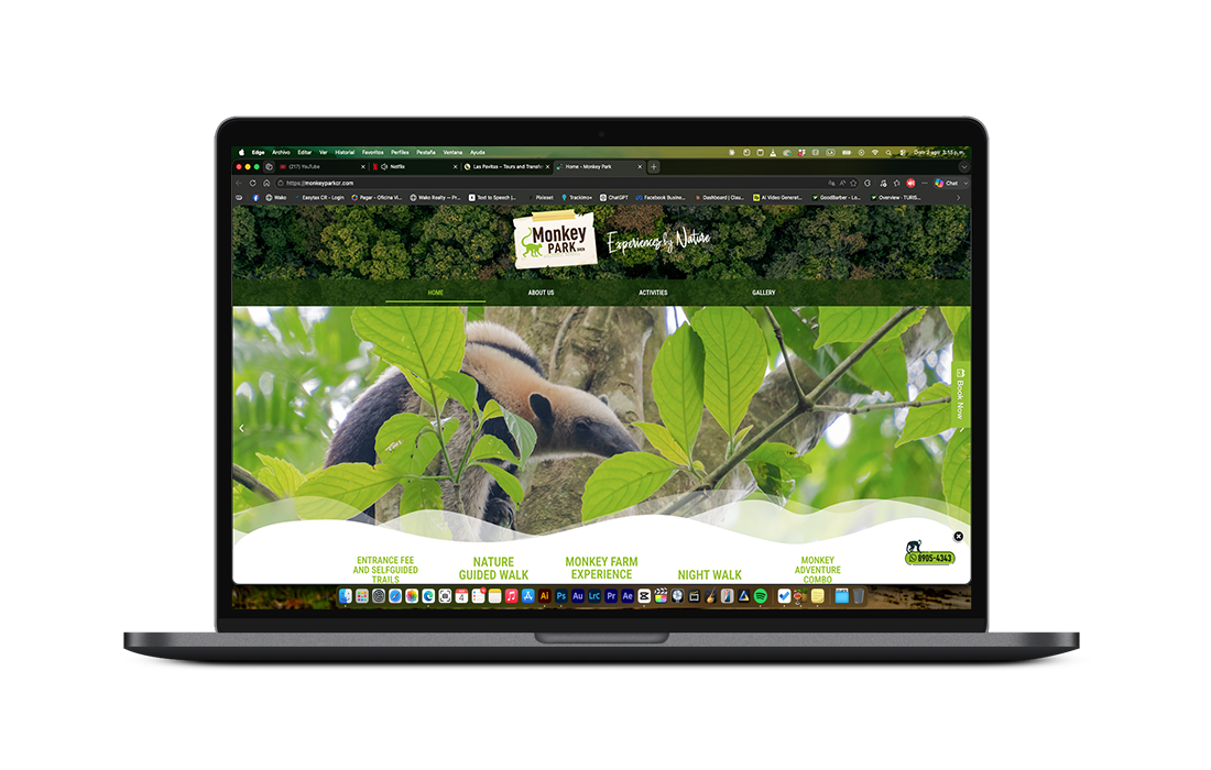 MacBook Pro displaying a nature-themed website with tropical wildlife and lush green forest imagery.