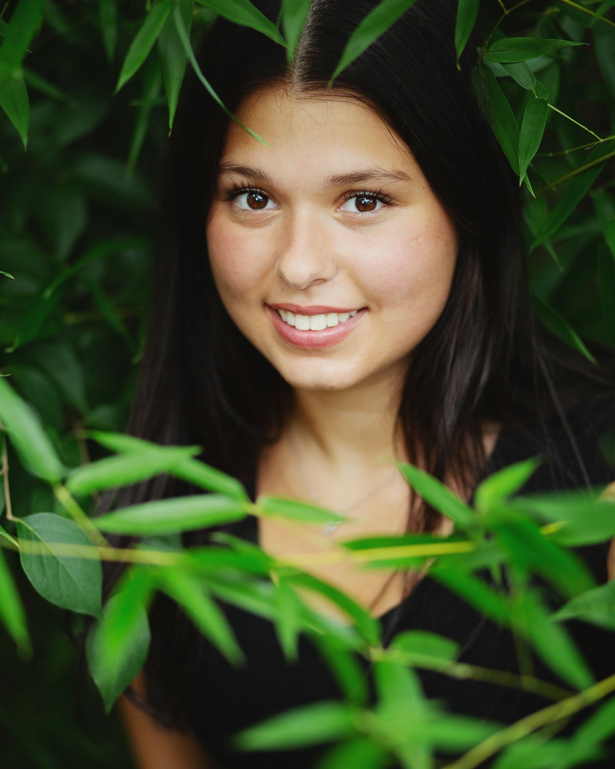 landscape photo of a girl in a white dress sitting on a concrete bench senior portrait anchorage ky