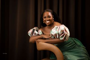 Intimate photo session with dark background and elegant green formal wear.