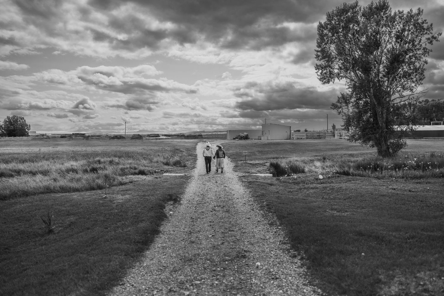 Black and White Image of Couple walkinga way