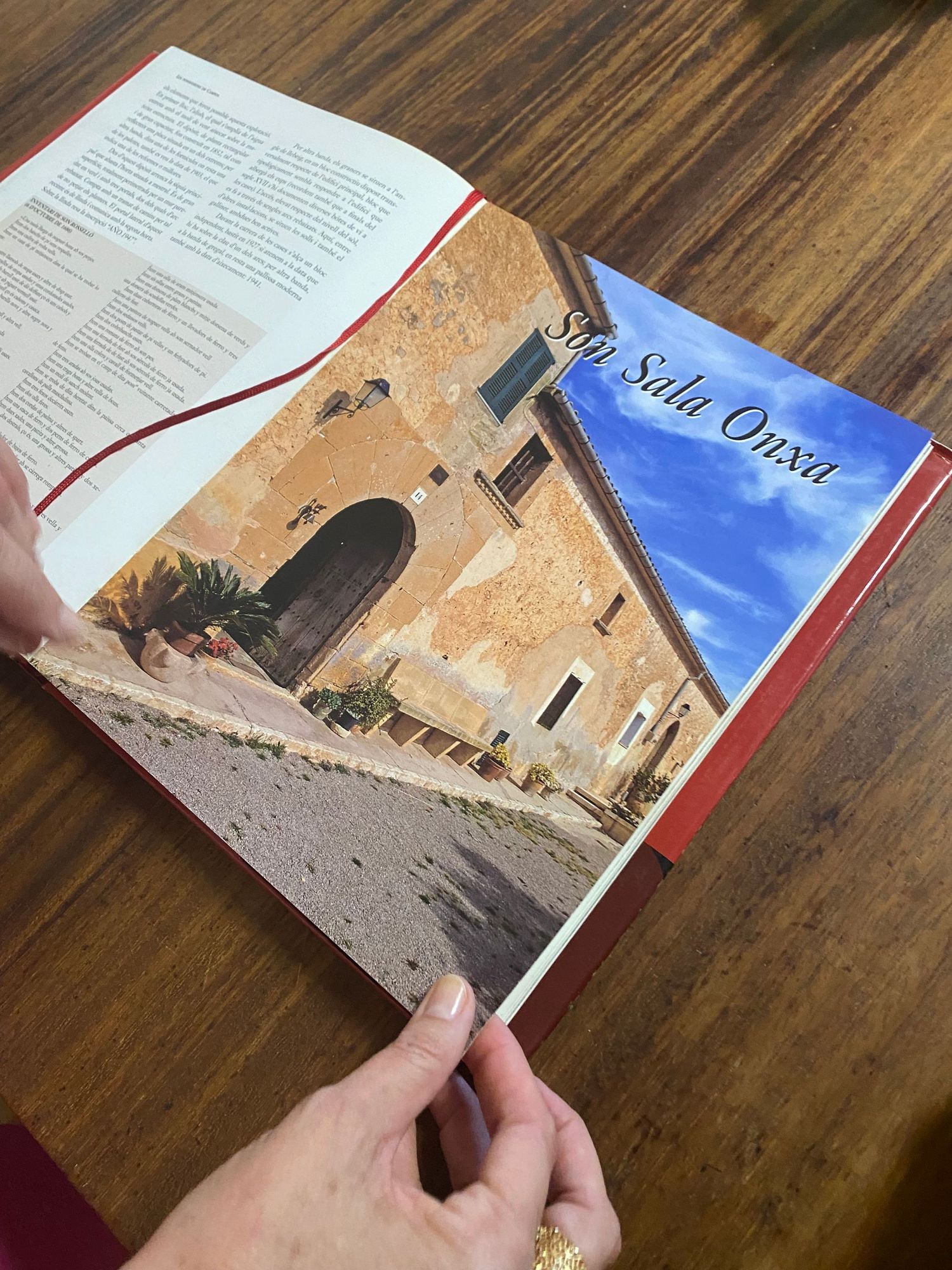 Open book showing photographs of historic Mediterranean architecture and buildings.