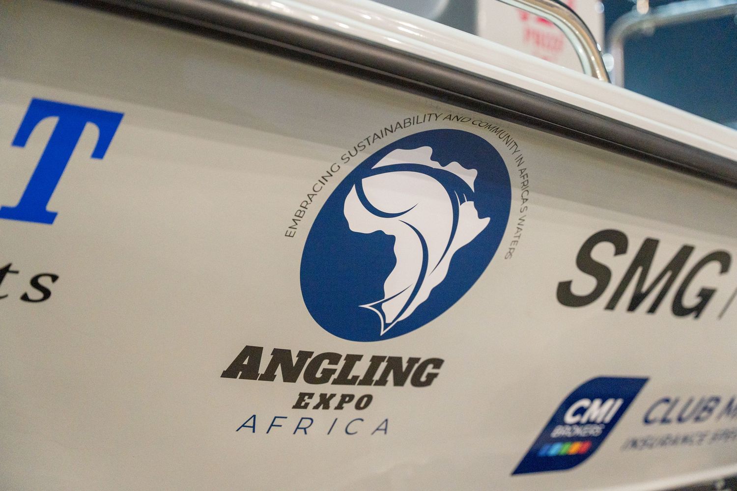 Blue and white Angling Africa logo on side of boat hull.