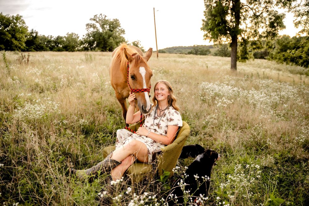 Senior photo with an Audi car in Boonville, MO, showcasing style and personality in a dynamic, scenic setting.