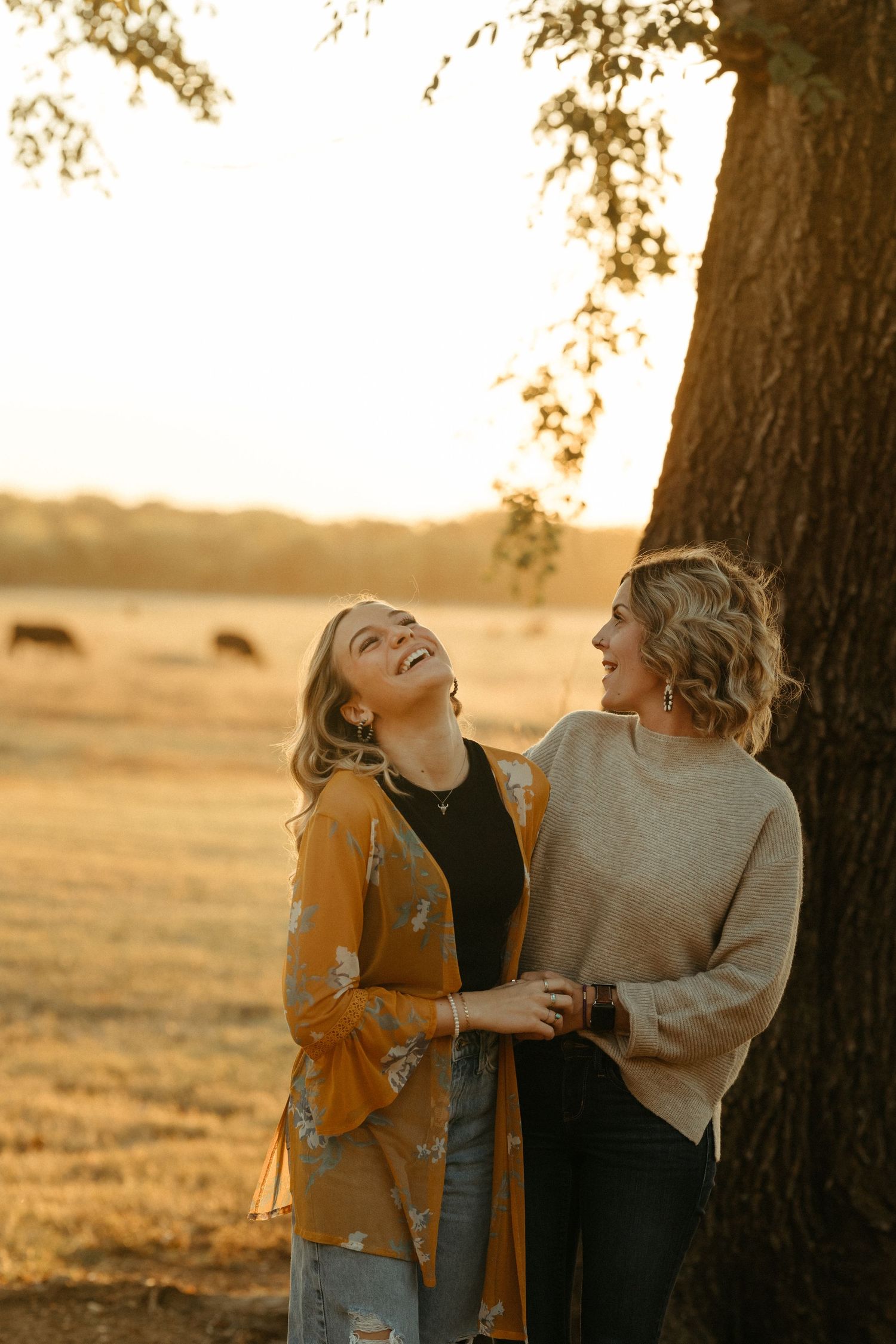 mom and daughter in field at sunset – emotional family photography in Kansas