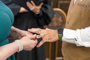 Close-up of hands exchanging business cards during a professional meeting or networking event.