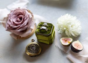 A collage of soft pink roses, white flowers and vintage decor items arranged in a delicate pastel color scheme.
