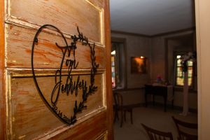 Heart carved into wooden door at historic Springlawn Inn.