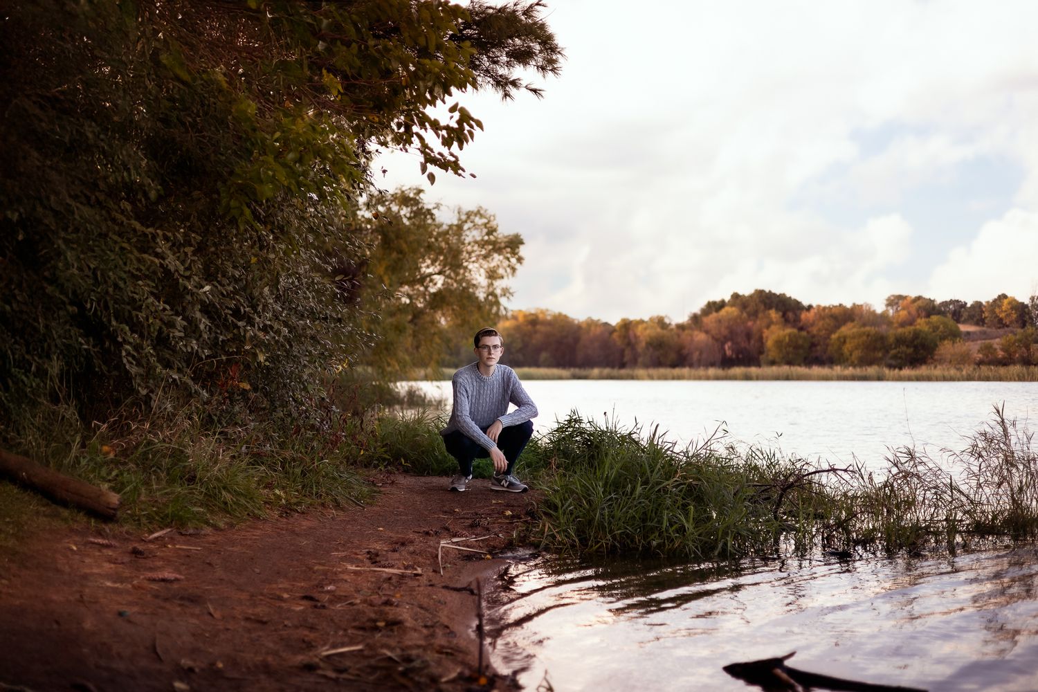 A scenic autumn landscape series showing lakeside views with colorful fall foliage and reflective waters at sunset.