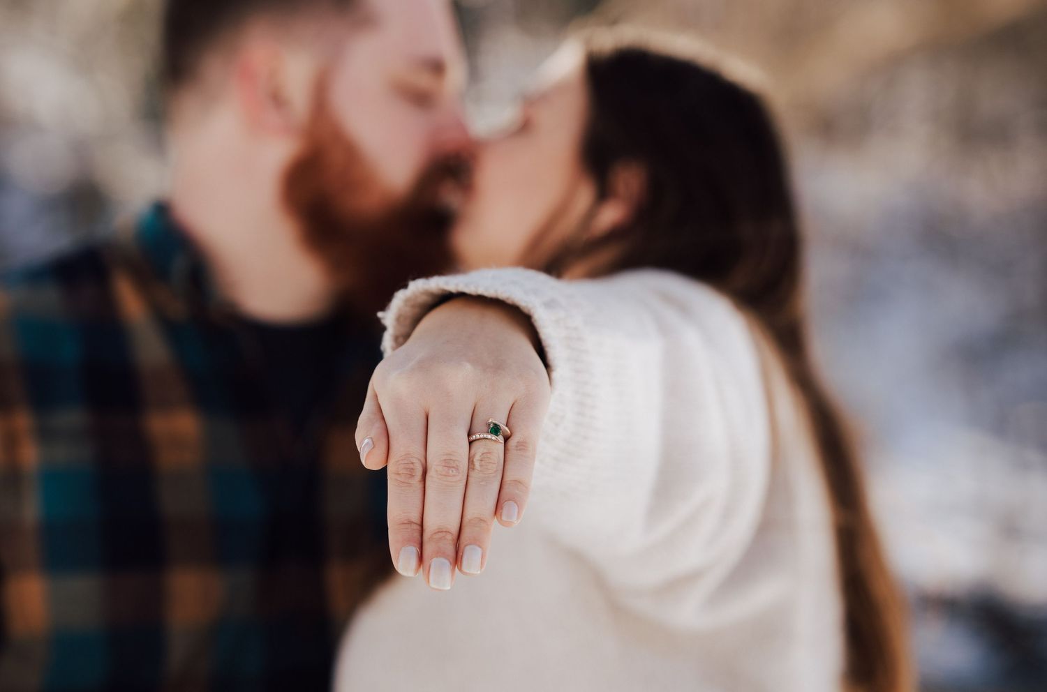 Romantic winter engagement photo session with bride showing engagement ring with a snowy background in Lancaster County, Pequea PA.