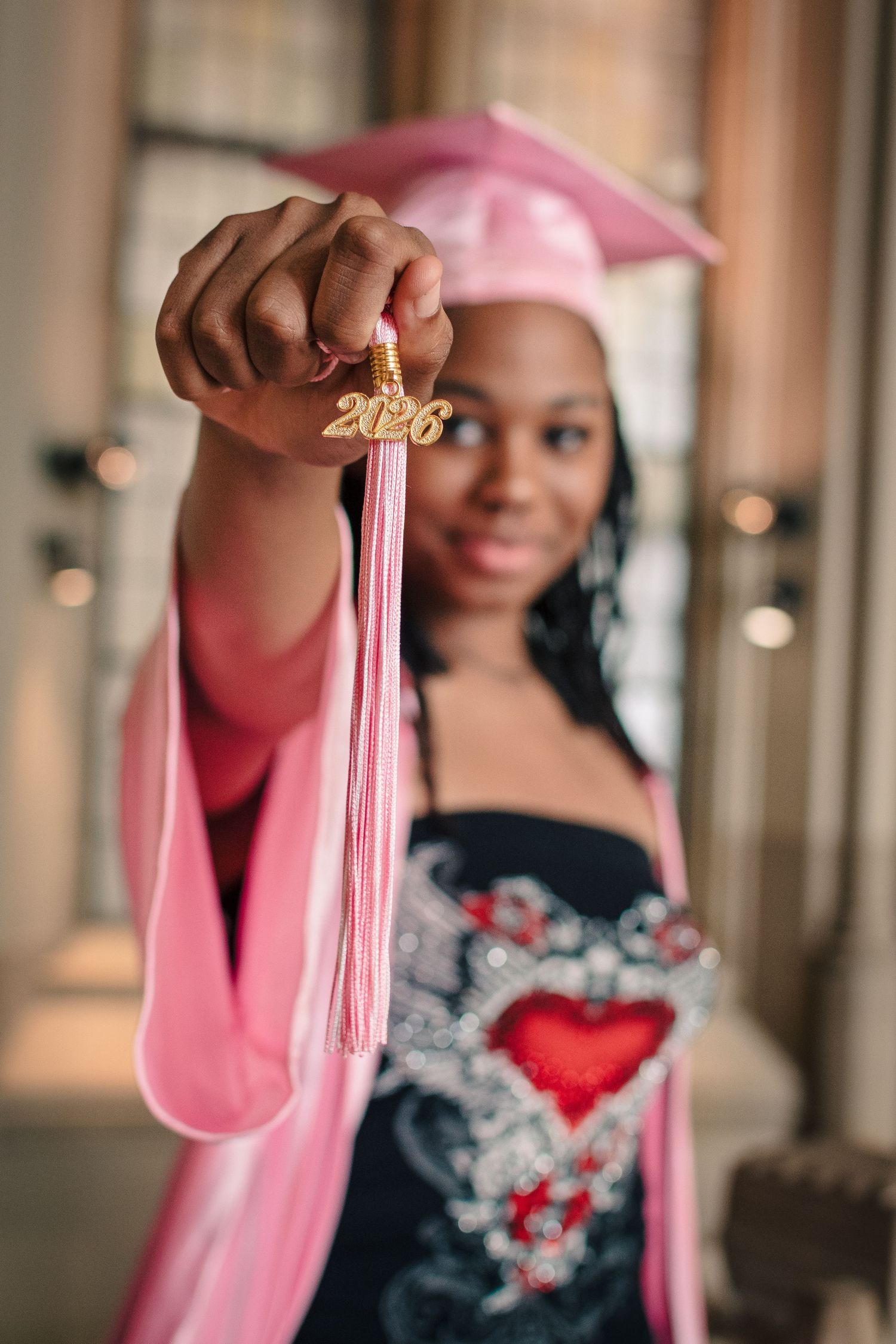 Close up of 2026 graduation tassel in pink cap and gown Seattle