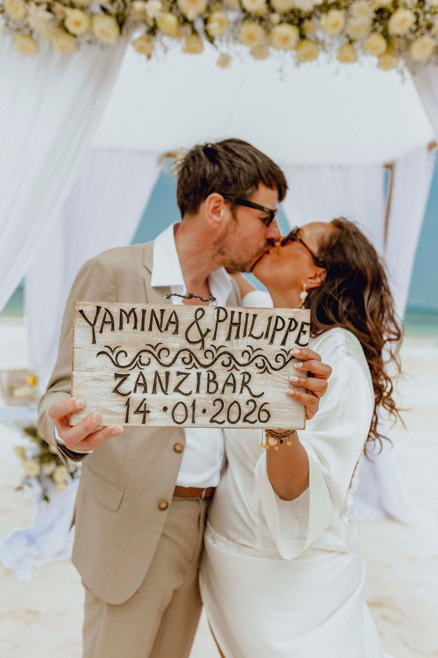 Happy newlyweds enjoying intimate moment by the ocean