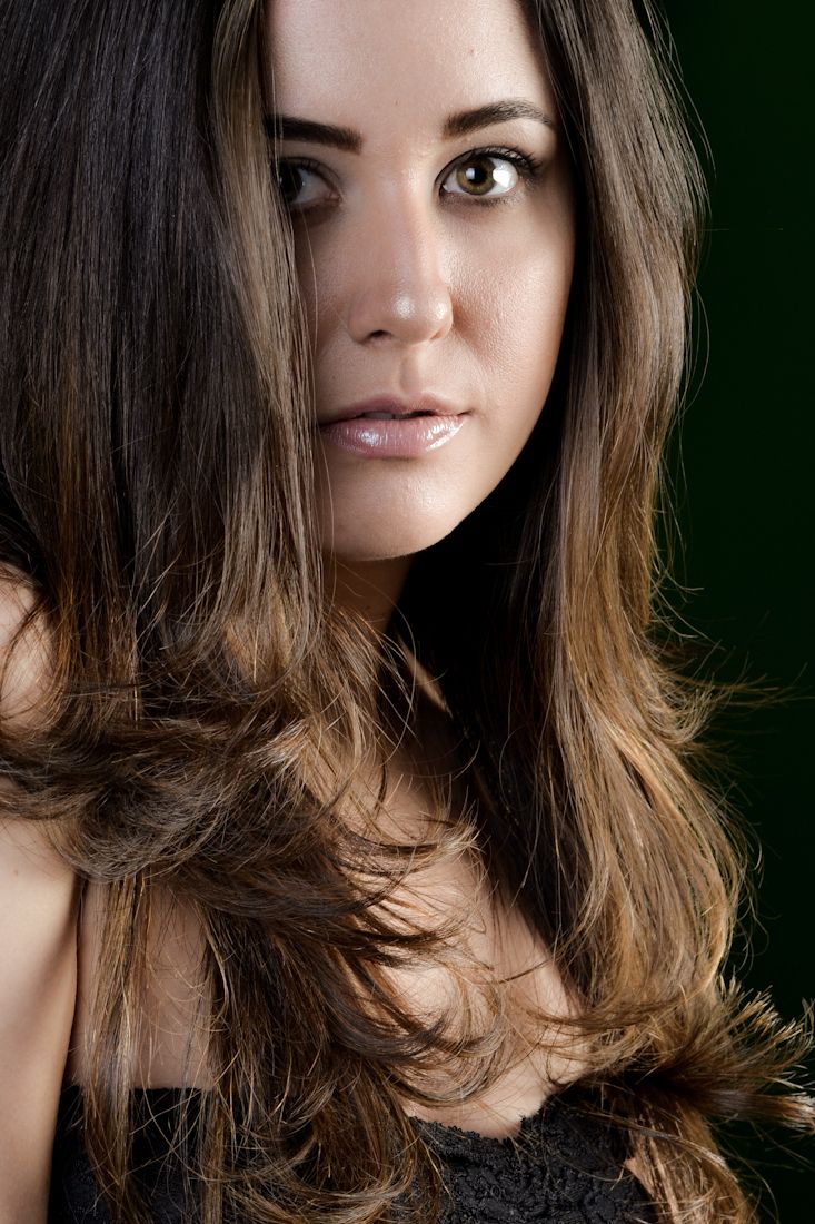 Close-up portrait series against dark background highlighting layered hairstyle.