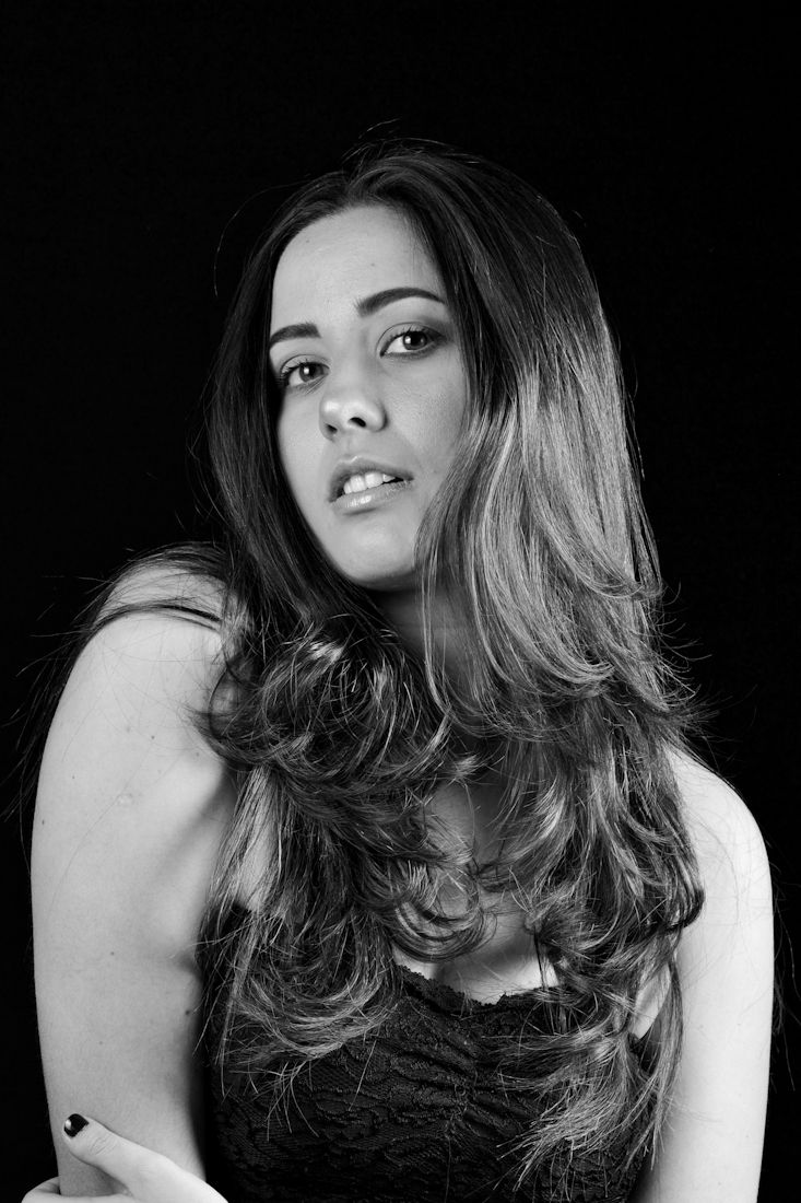 Dramatic black and white photo series featuring dynamic hair movement and poses.