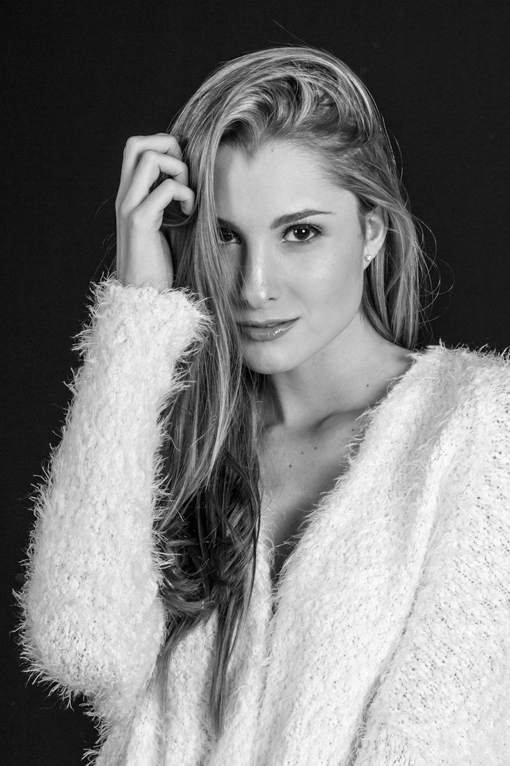 Fashion portraits featuring white textured sweater against dark background.