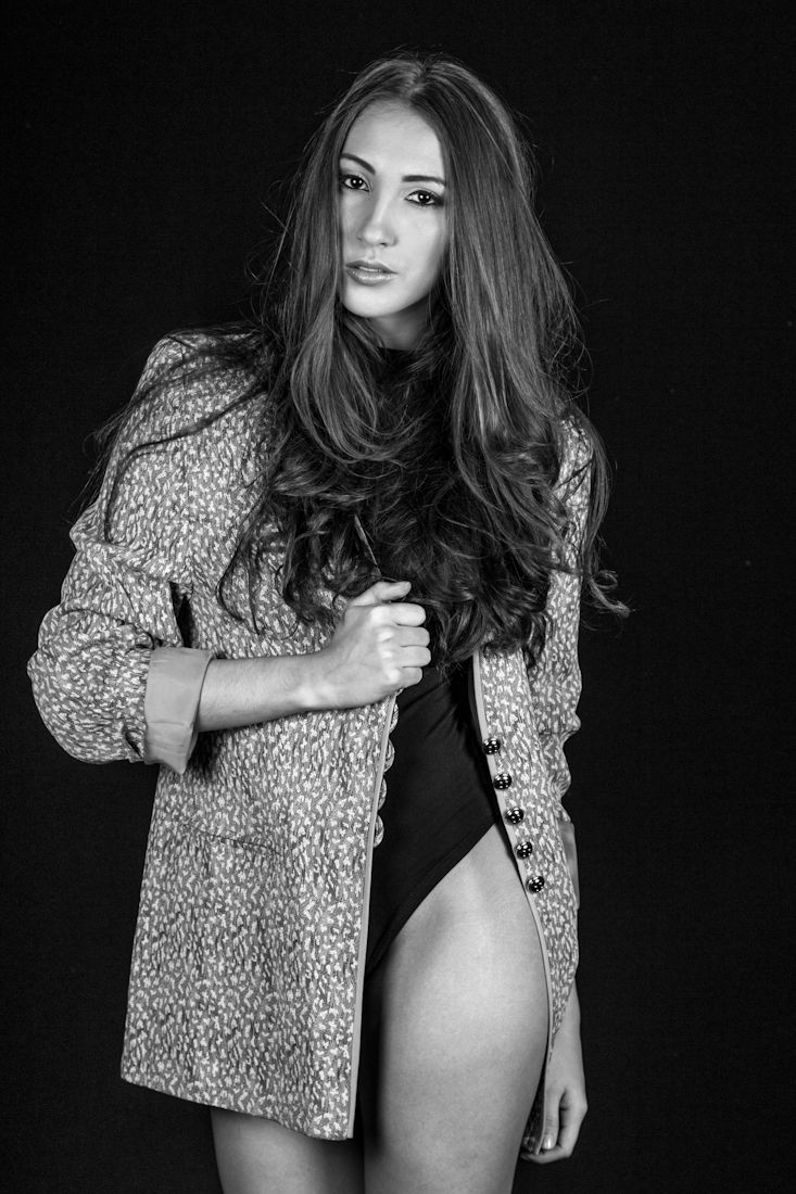 Artistic black and white fashion portraits featuring model in leopard print jacket.