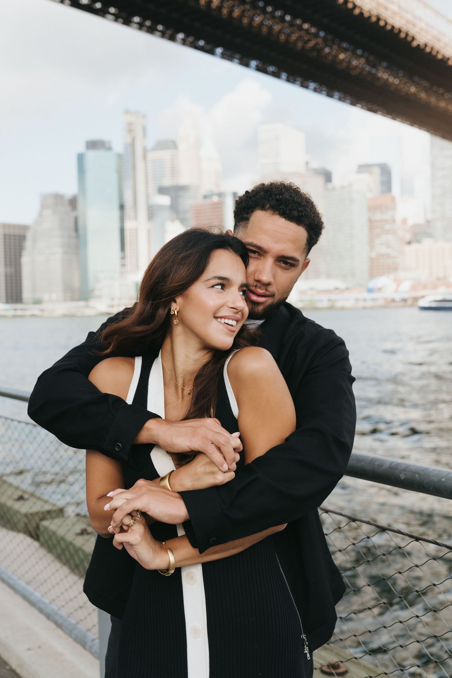 Couple embracing and laughing during their couples session in Brooklyn New York