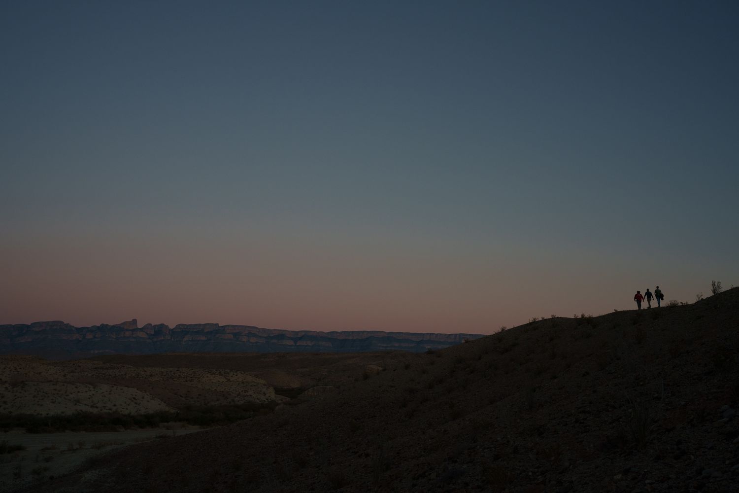 A series of landscape photos showing mountains and hills at sunset with silhouettes against an orange sky.