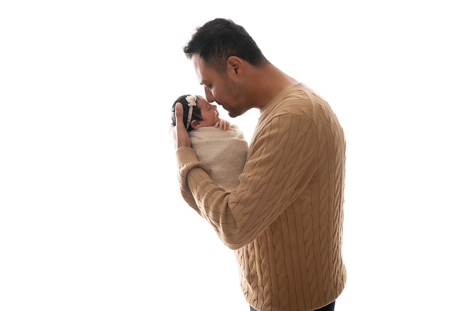 Person in tan sweater takes photos with a digital camera from multiple angles against white background.