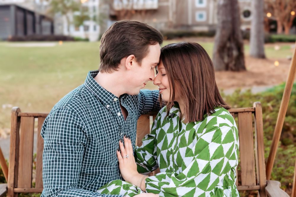 Sunset engagement photos on dock at The Ritz-Carlton Reynolds Lake Oconee