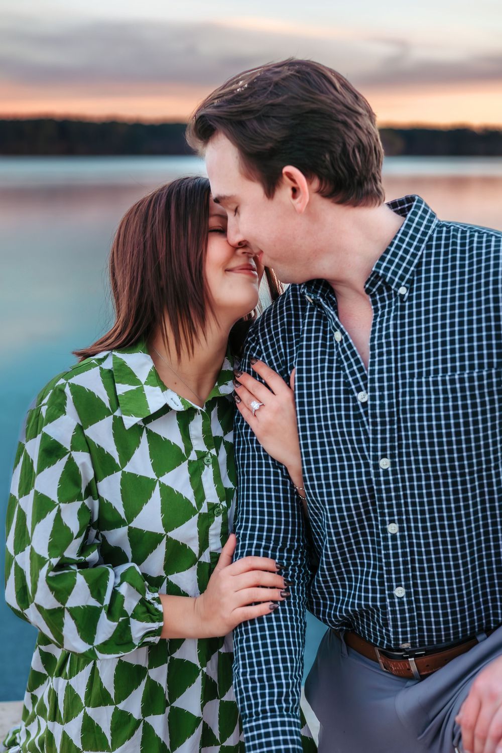 Sunset engagement photos on dock at The Ritz-Carlton Reynolds Lake Oconee