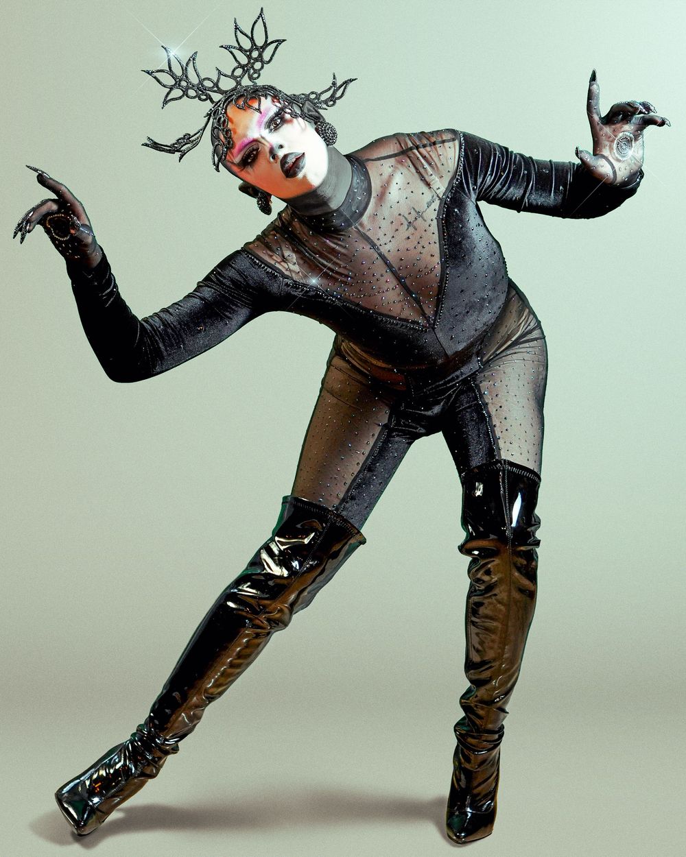 A sequence of fashion photos showing a model in a gray sweater and brown pants performing dynamic dance movements.