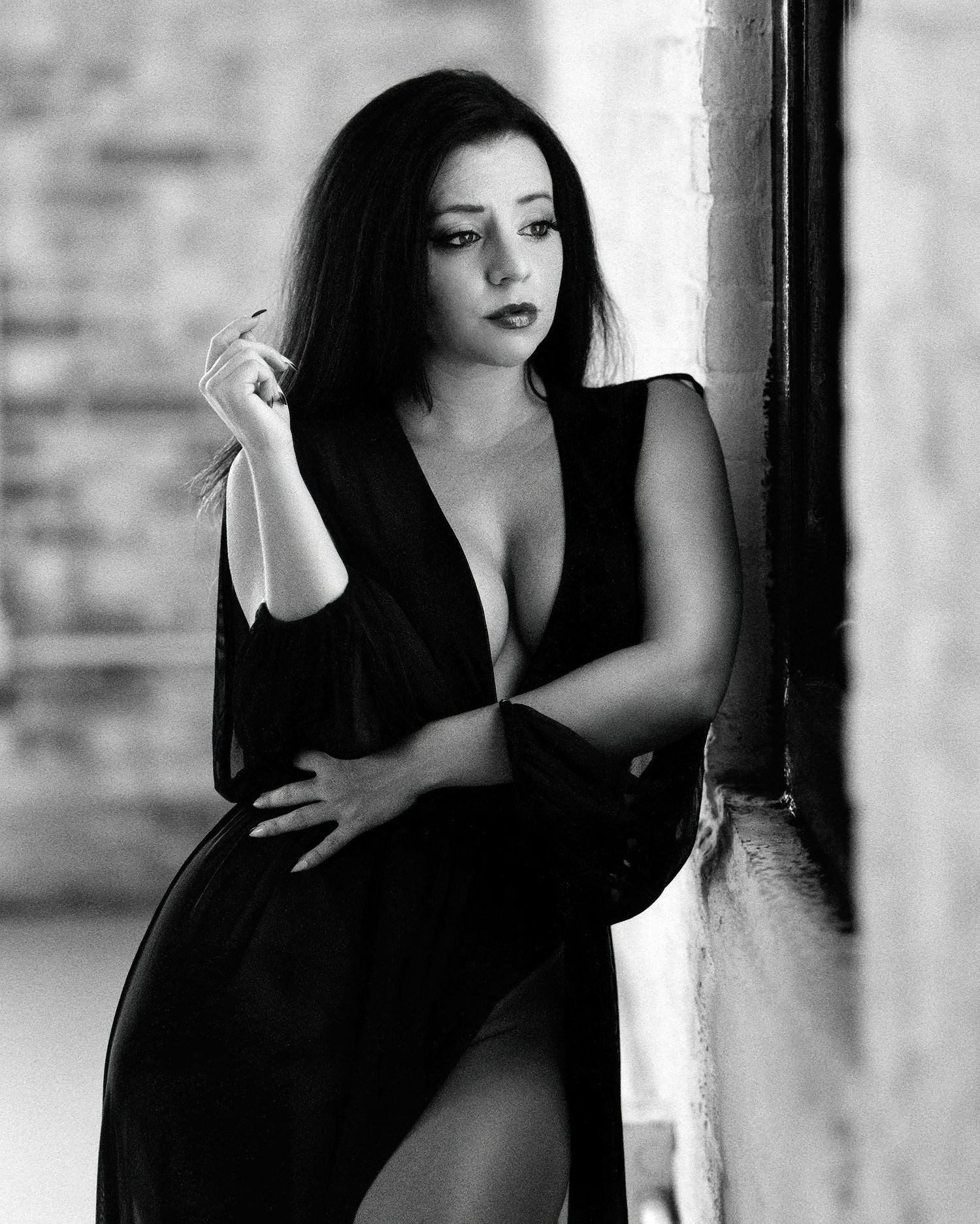 David G Holt Photography - Artistic black and white fashion portraits showing dramatic poses against a brick wall backdrop.