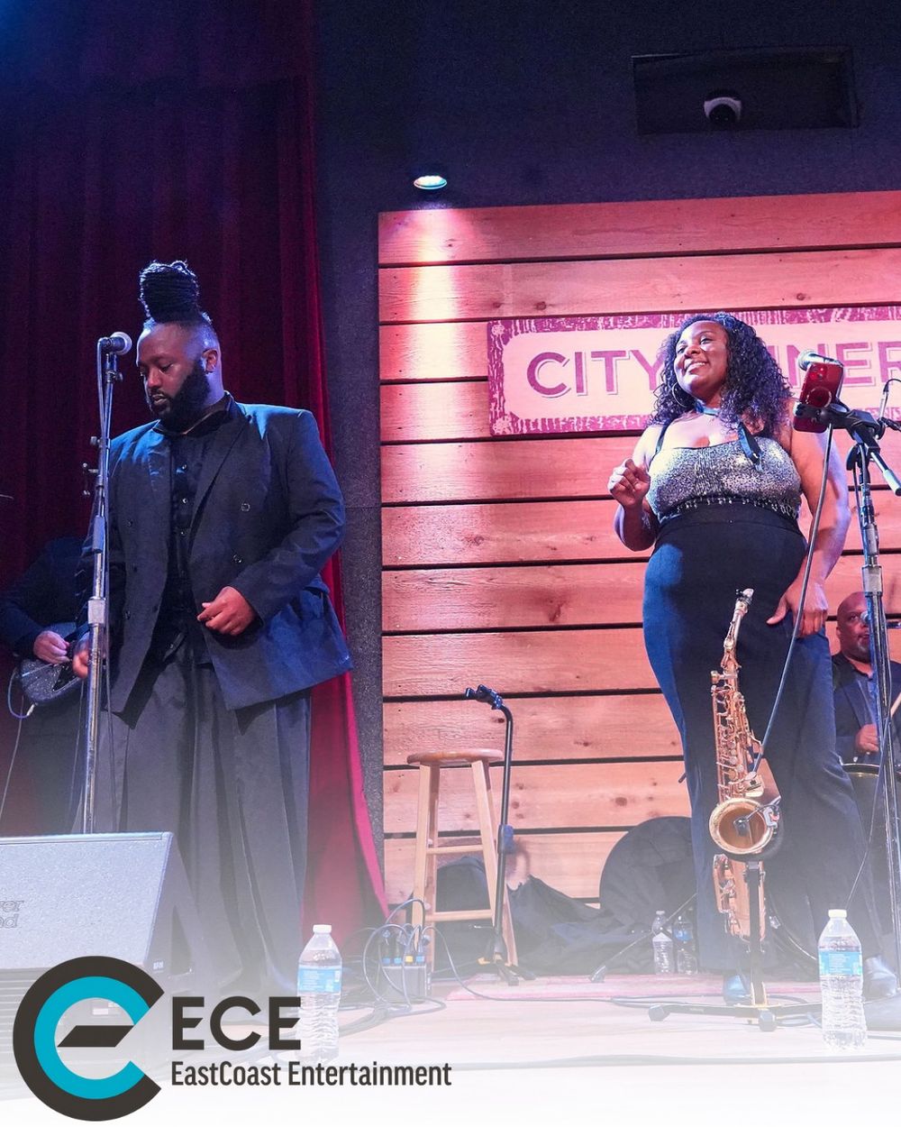 Musicians performing on stage at City Winery with EastCoast Entertainment branding.