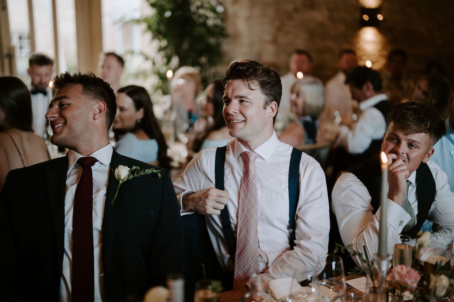 wedding guests laughing during father of bride speech at ivy lodge in cirencester