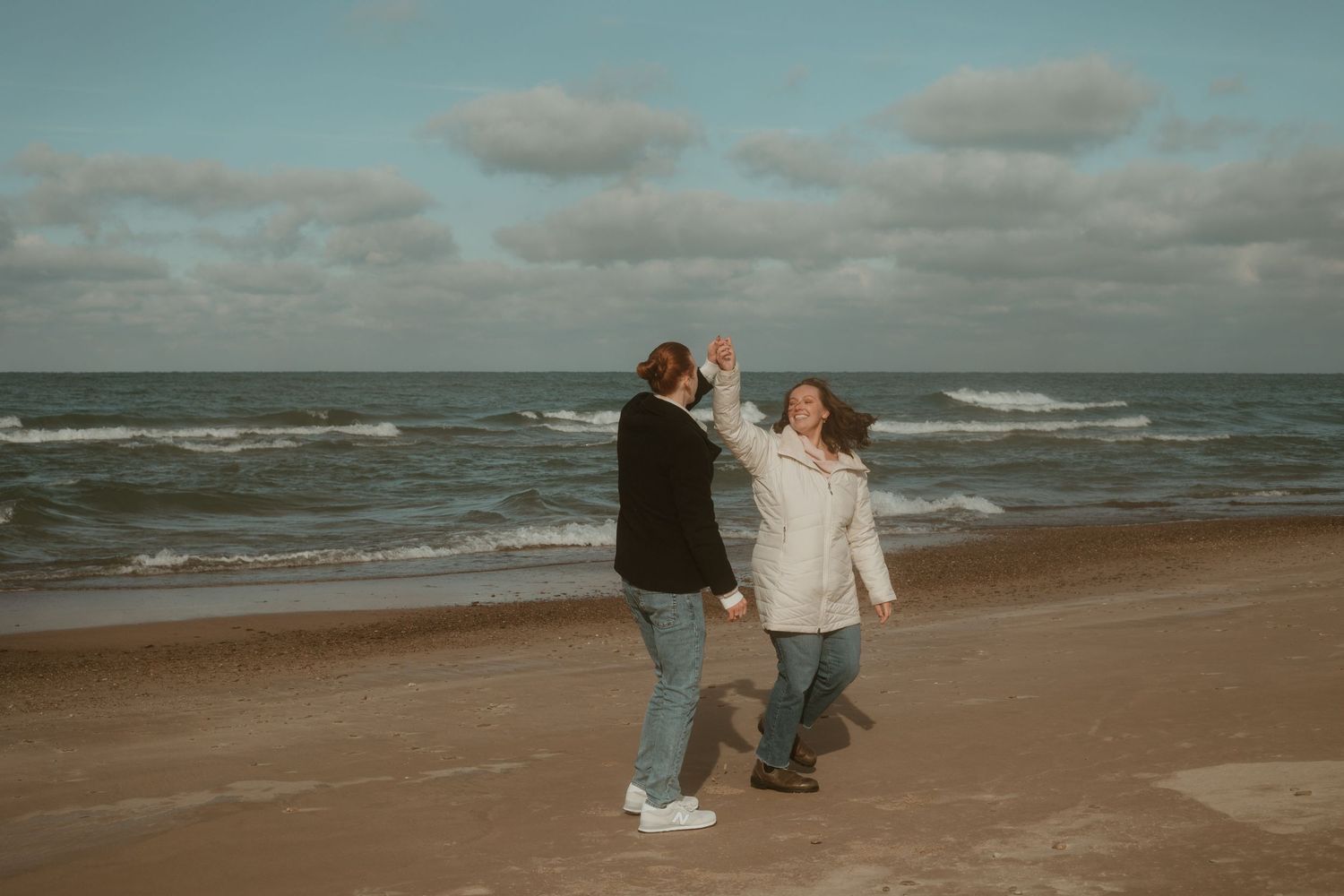 man and woman dancing on Indiana dune's beach