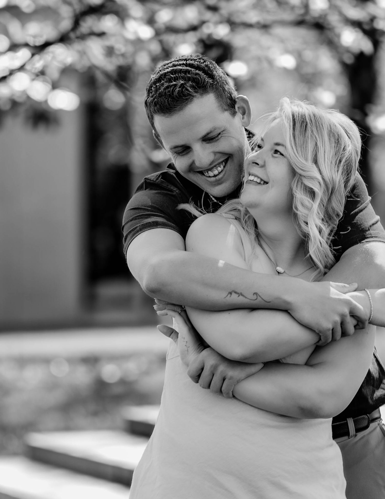 A romantic series of black and white wedding photos showing a couple embracing and sharing intimate moments together.
