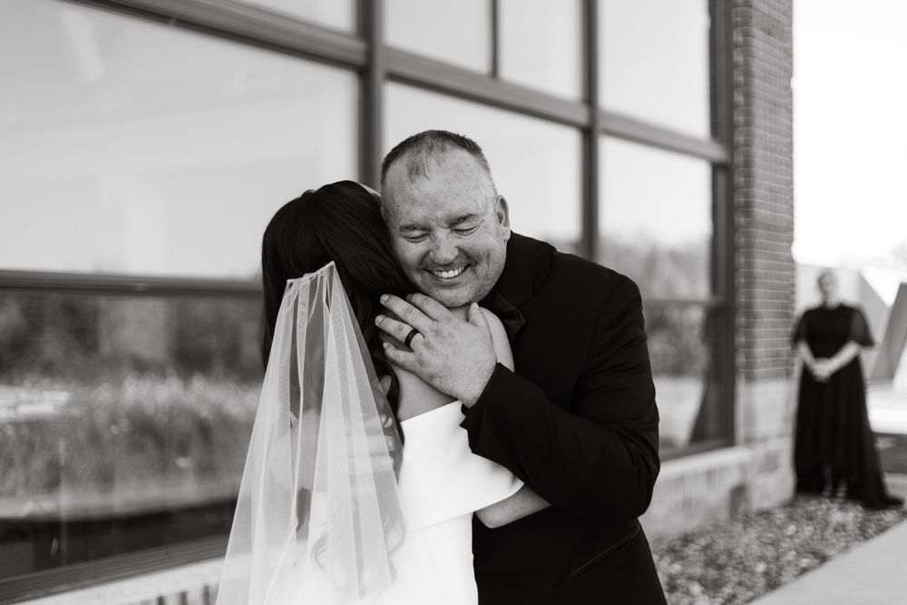 Black and white wedding photography captures intimate moments between a couple on their special day.