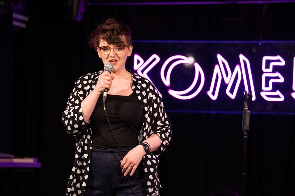 comedian on stage at komedia