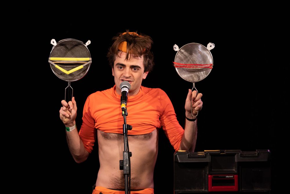 comedian on stage at Komedia