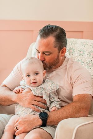 Cozy in-home newborn photos in Kirkwood. Faith’s Flicks captures those first fleeting days in the comfort of your own nursery. Booking 2026