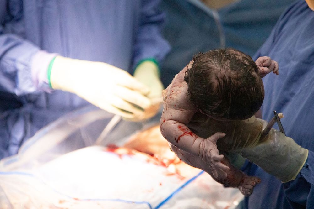 Emotional birth photography in Johannesburg showing skin-to-skin contact, newborn bonding, and the power of childbirth.