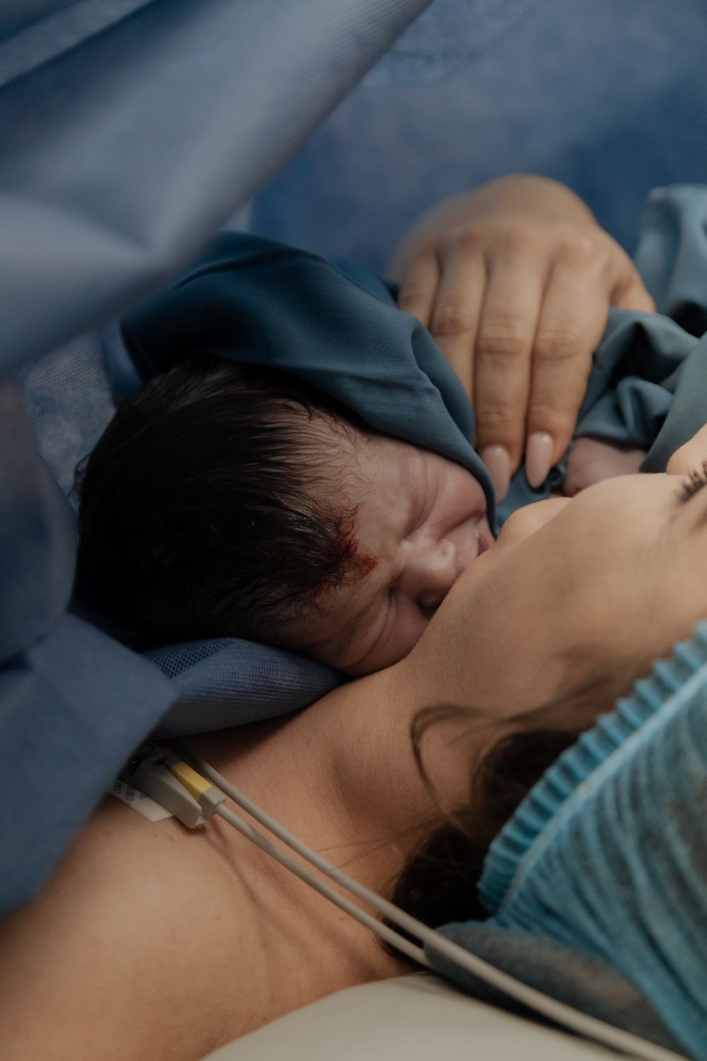 Emotional birth photography in Johannesburg showing skin-to-skin contact, newborn bonding, and the power of childbirth.