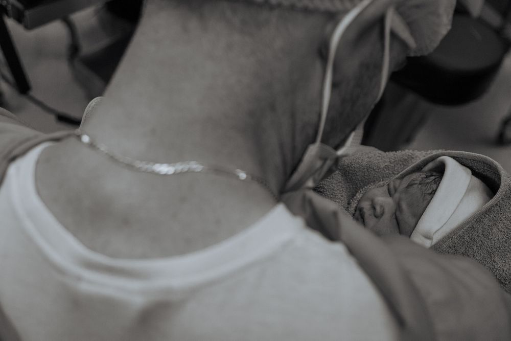 Emotional birth photography in Johannesburg showing skin-to-skin contact, newborn bonding, and the power of childbirth.