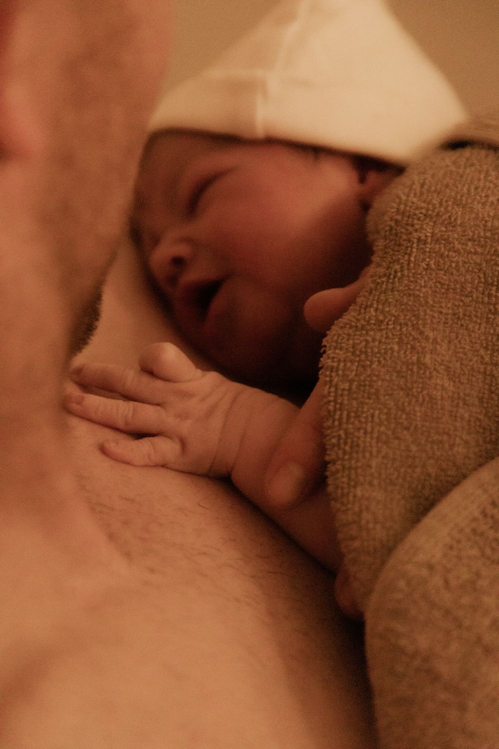 Emotional birth photography in Johannesburg showing skin-to-skin contact, newborn bonding, and the power of childbirth.