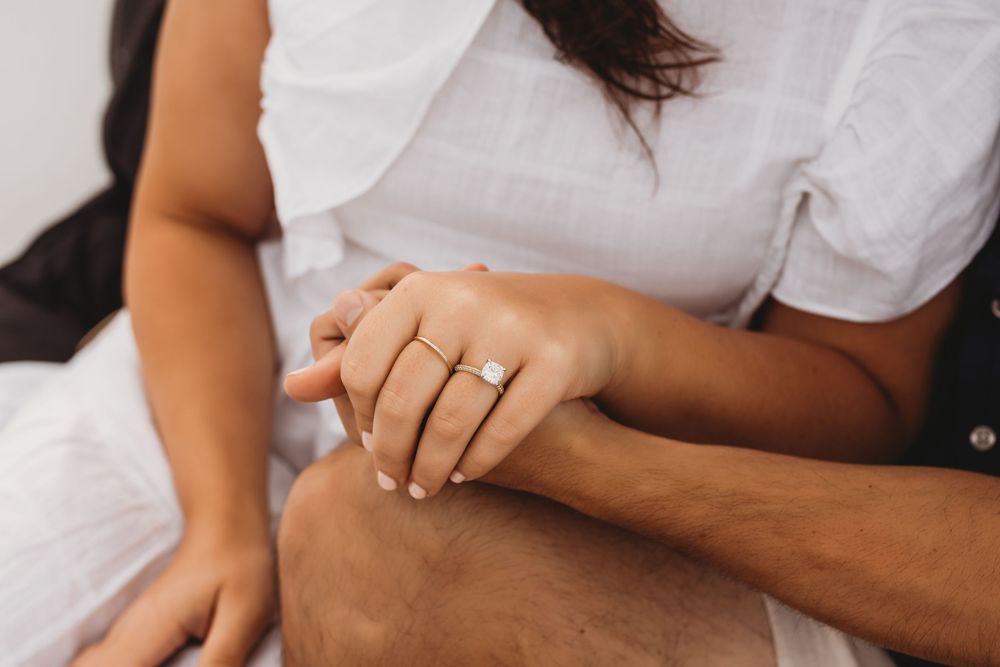 Surprise proposal on a boat near Honeymoon Island Florida with emotional reaction and ocean backdrop