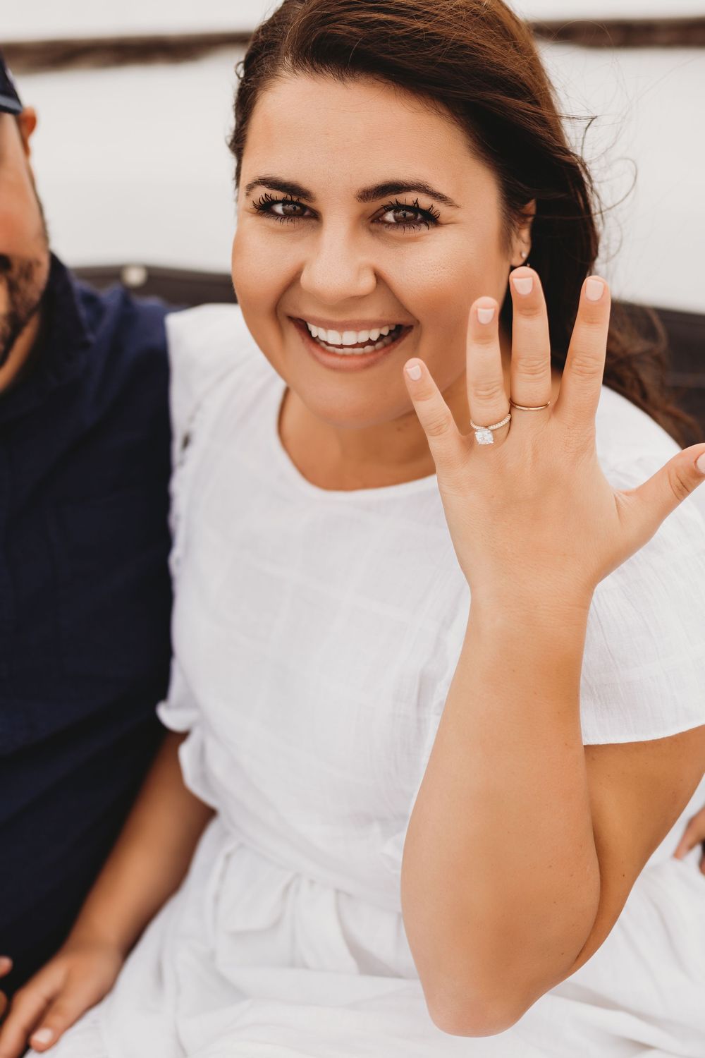 Surprise proposal on a boat near Honeymoon Island Florida with emotional reaction and ocean backdrop