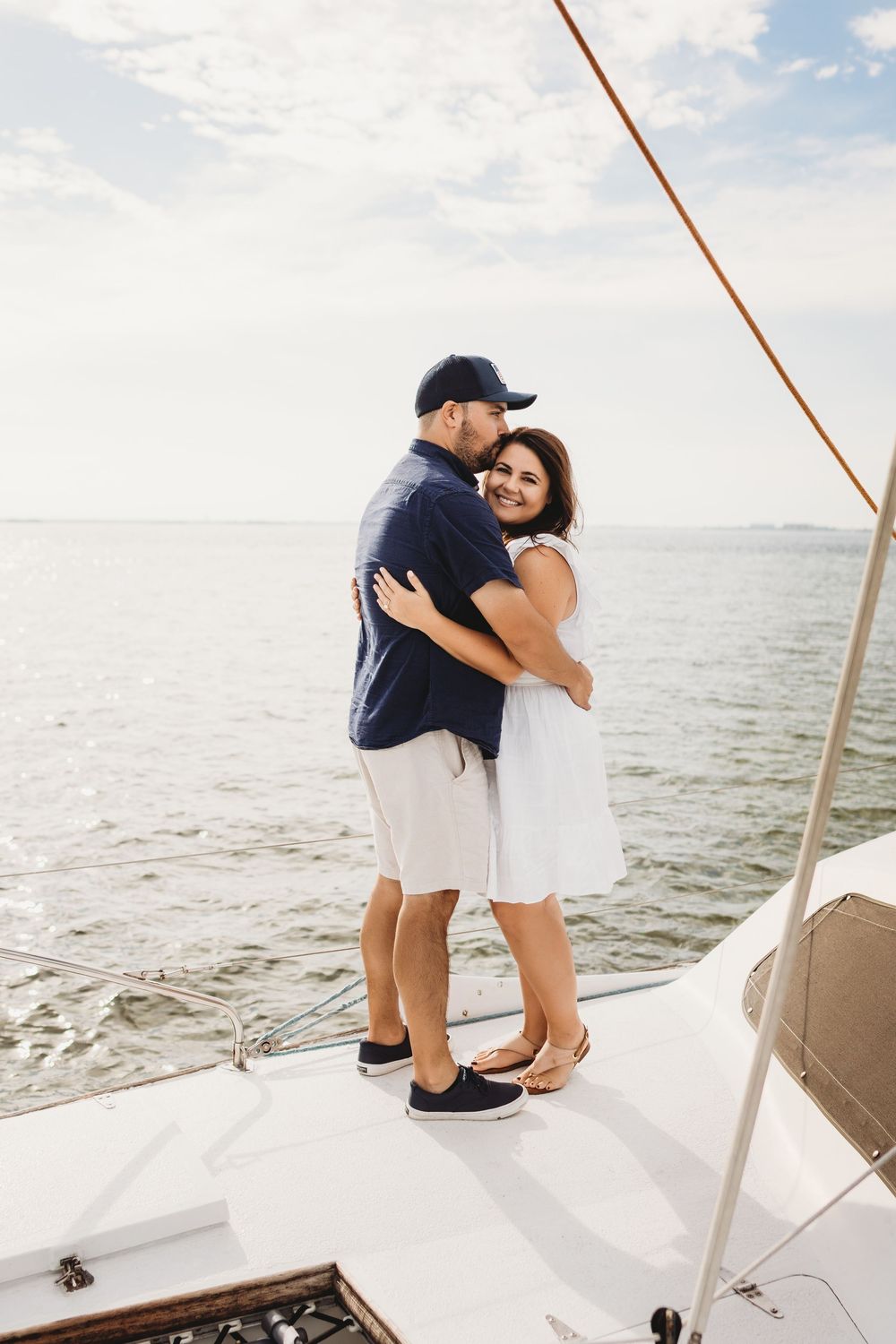 Engaged couple celebrating after a boat proposal off Honeymoon Island Florida