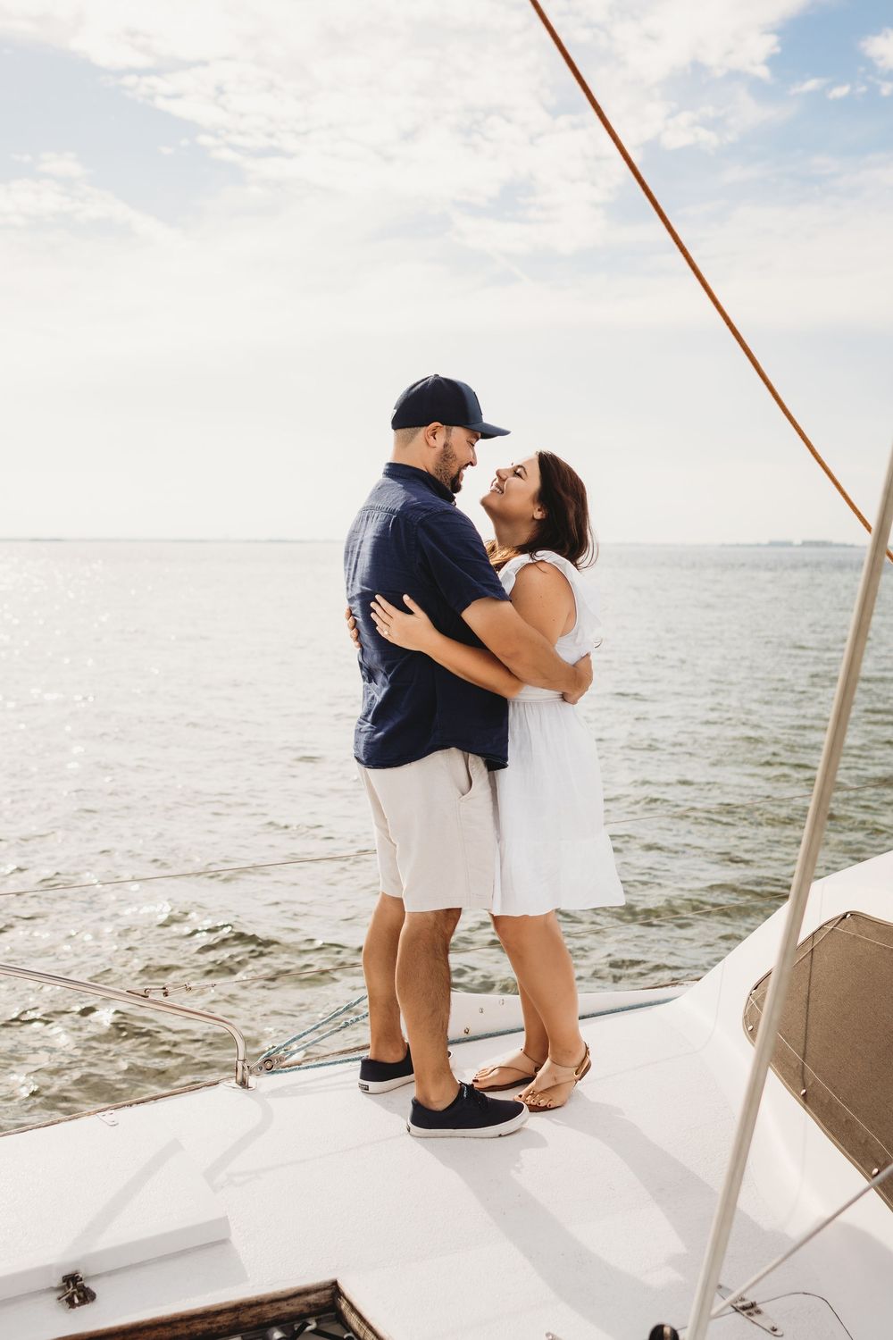 Engaged couple celebrating after a boat proposal off Honeymoon Island Florida