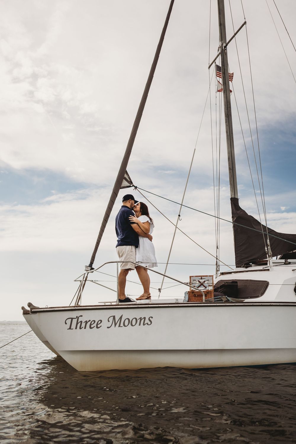 Man proposing on a boat off Honeymoon Island with clear water and coastal scenery