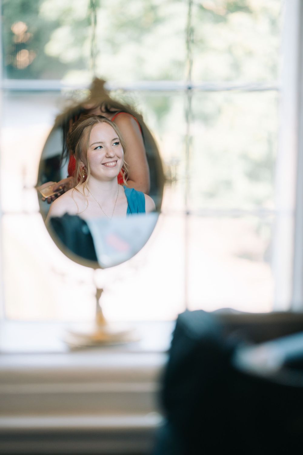 Artistic blurred wedding photography through circular frames showing soft, dreamy moments.