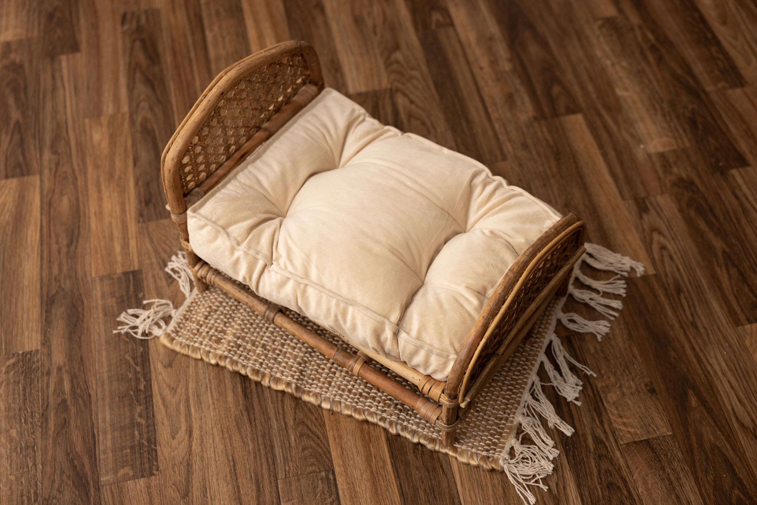 Rattan cane newborn bed with off white mattress