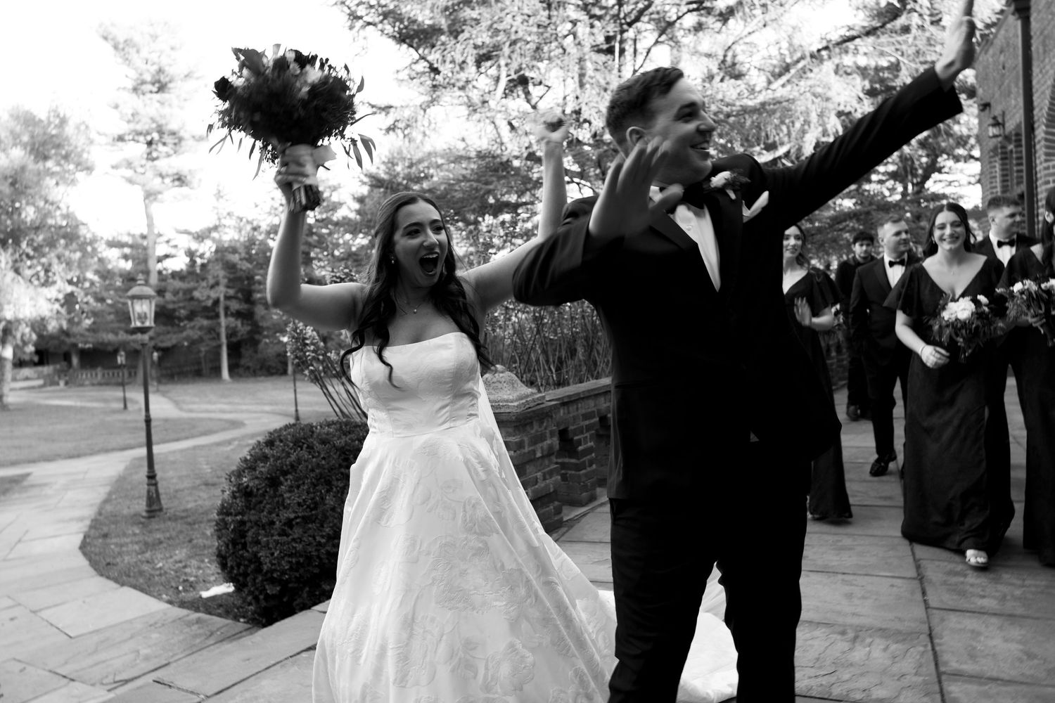 A collection of black and white wedding photographs showing couples dancing and embracing at an outdoor reception.