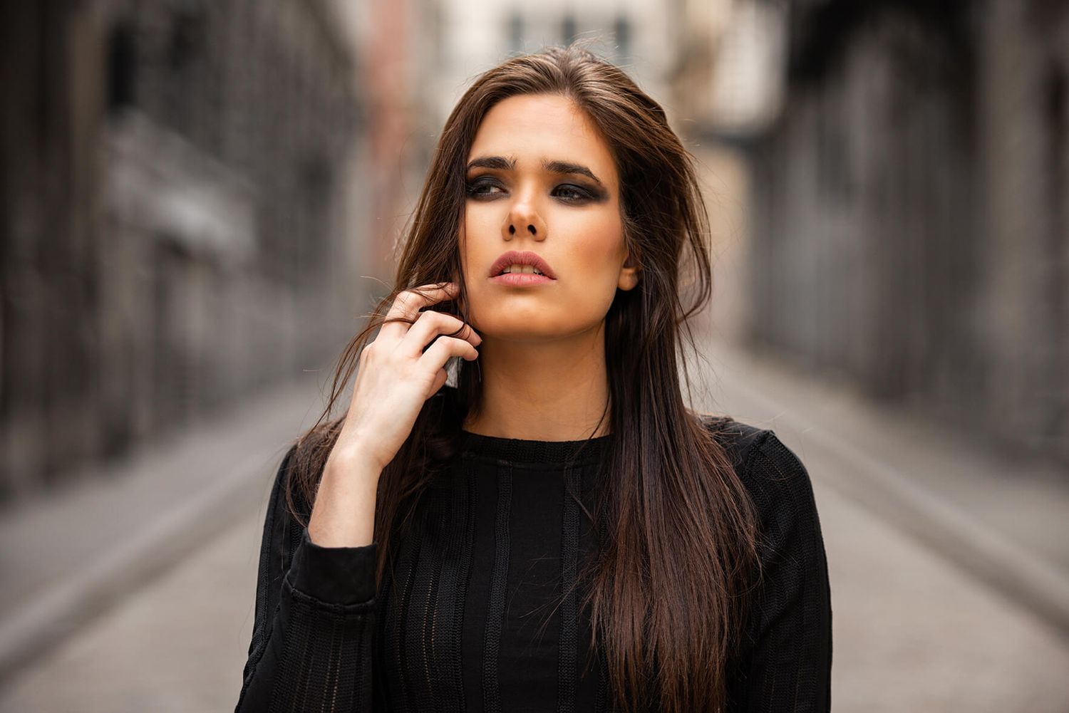 Dramatic fashion portrait with moody lighting.