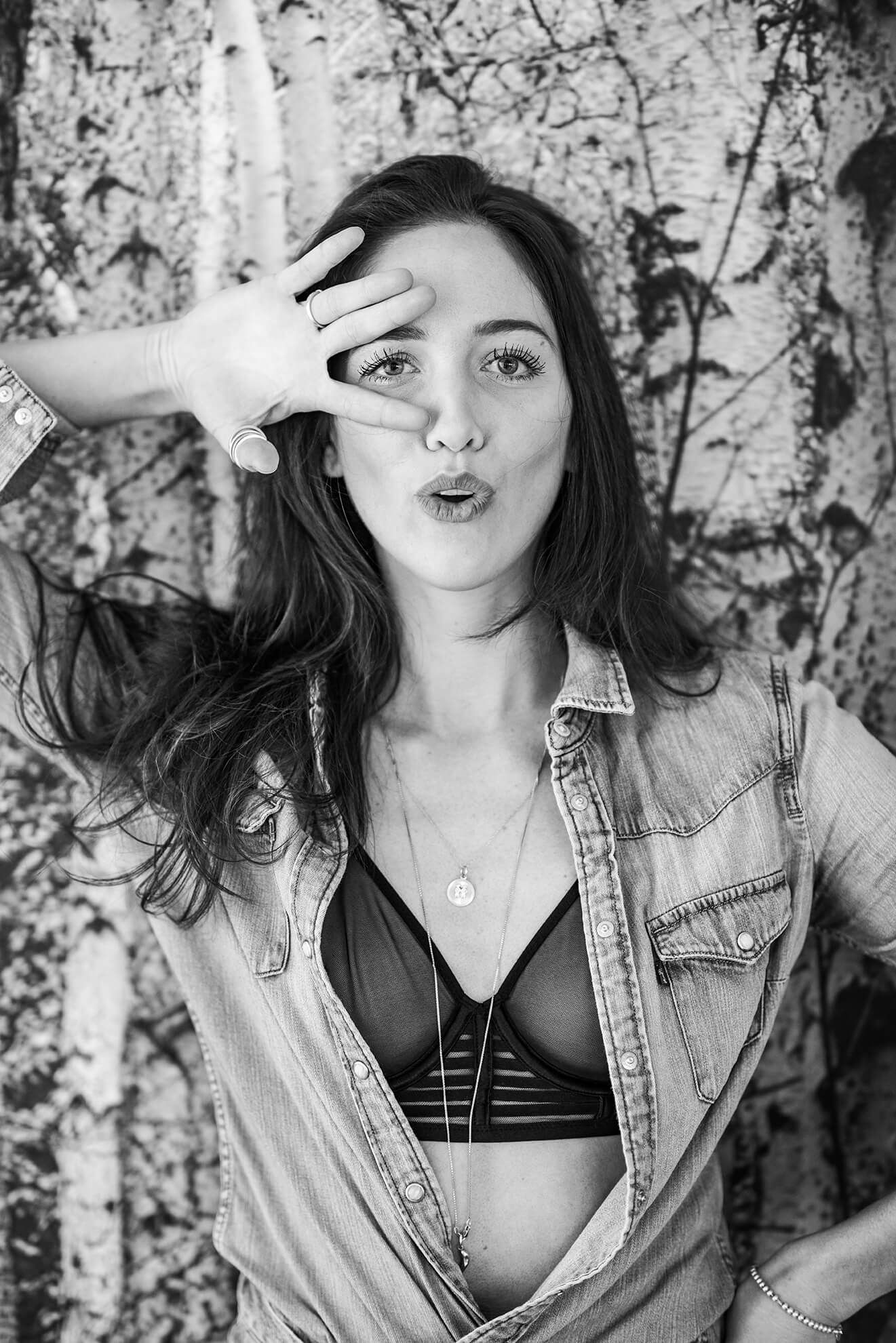 Fashion portraits with denim jacket against natural birch tree background.