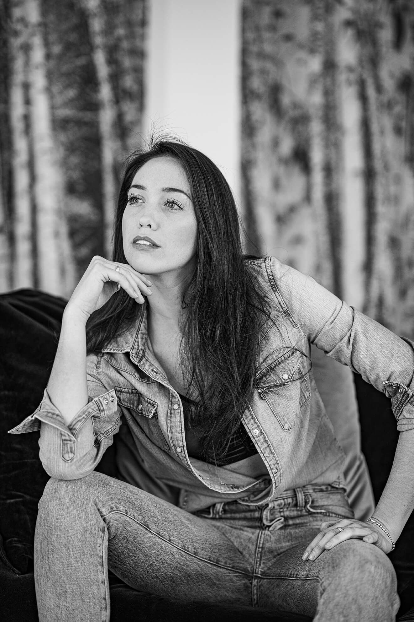 Black and white portraits with birch tree wallpaper showing casual denim styling.