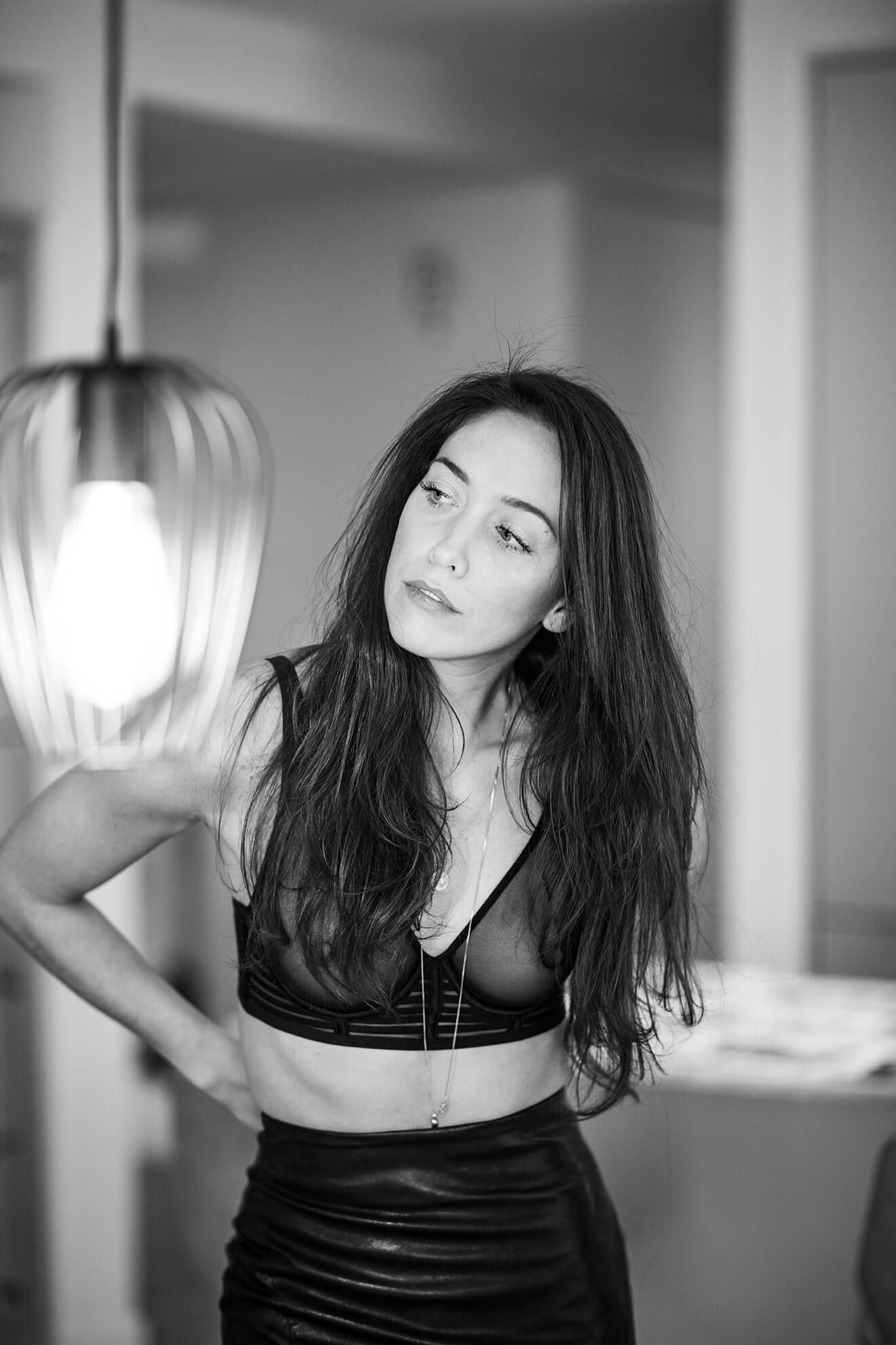 Dramatic black and white studio portraits with artistic lighting and expressive poses.
